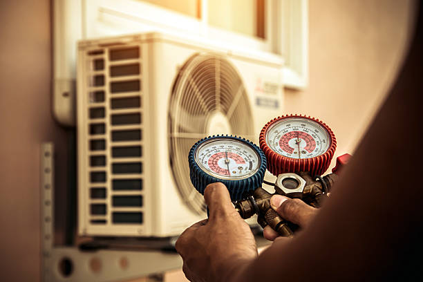 Professional Air Conditioning Service technician working in Clark, SD